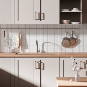 neutral warm toned kitchen with taupe cabinets and a butcher block countertop. 