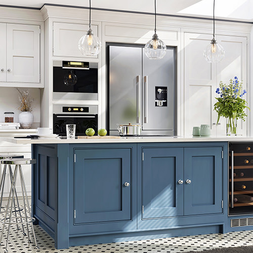 How To Choose A Kitchen Cabinet Color Tips From A Designer Image 7 Modern style kitchen with white cabinets, blue island cabinets, and white countertops.