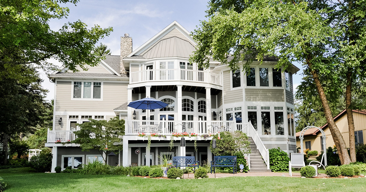 PMV - Blog - Can You Paint Vinyl Siding Header Image of a house with freshly painted vinyl siding.