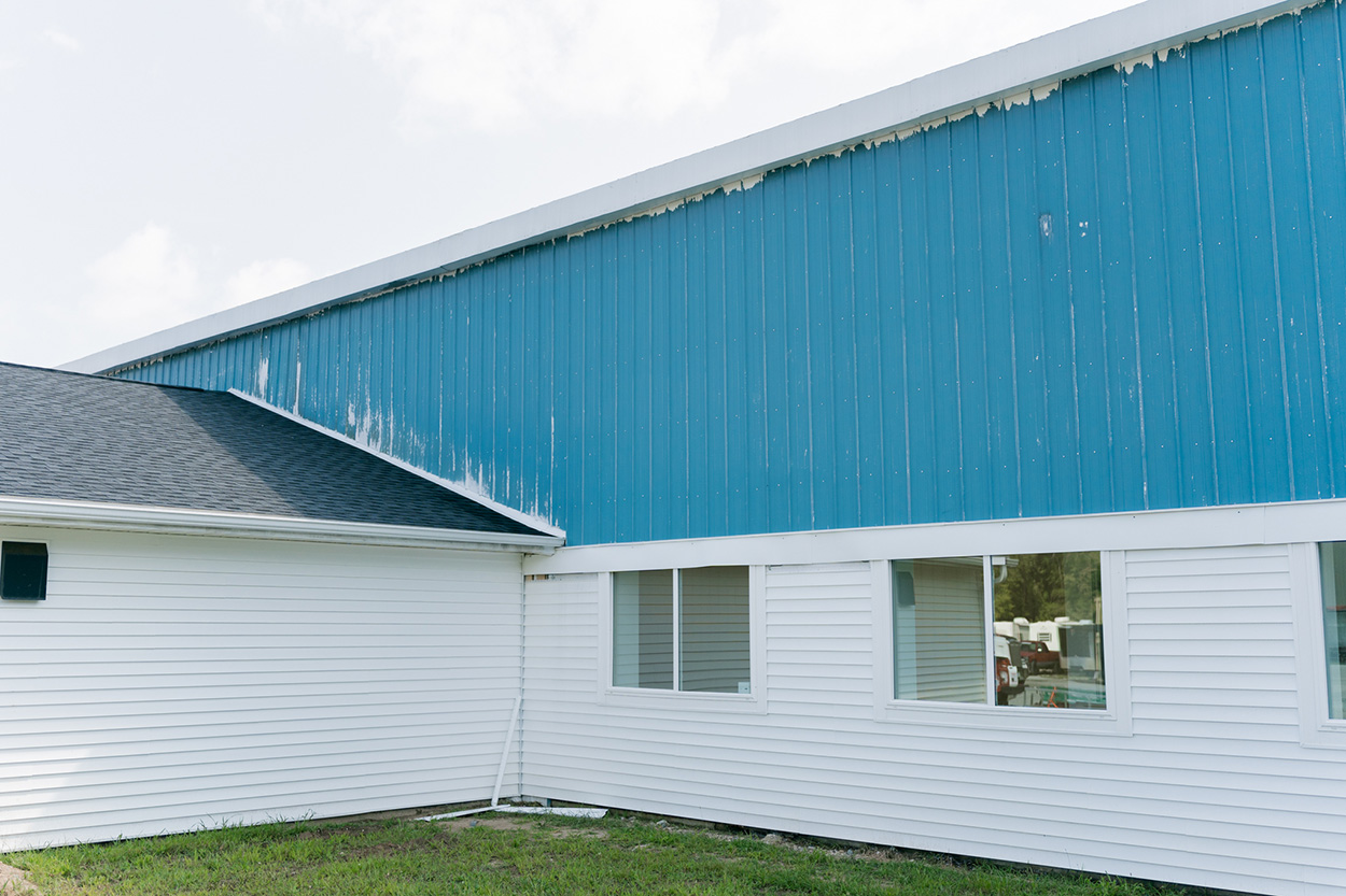 PMV - Project Highlight - Kalamazoo Valley Gleaners 2 Exterior of commercial building that needs repainted.