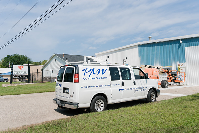 PMV - Project Highlight - Kalamazoo Valley Gleaners 3 PMV van in front of the Gleaners building while being painted