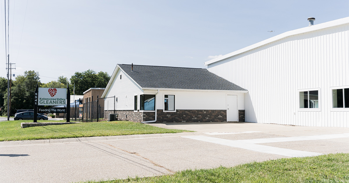 PMV - Project Highlight - Kalamazoo Valley Gleaners Header Freshly painted white exterior of a commercial building