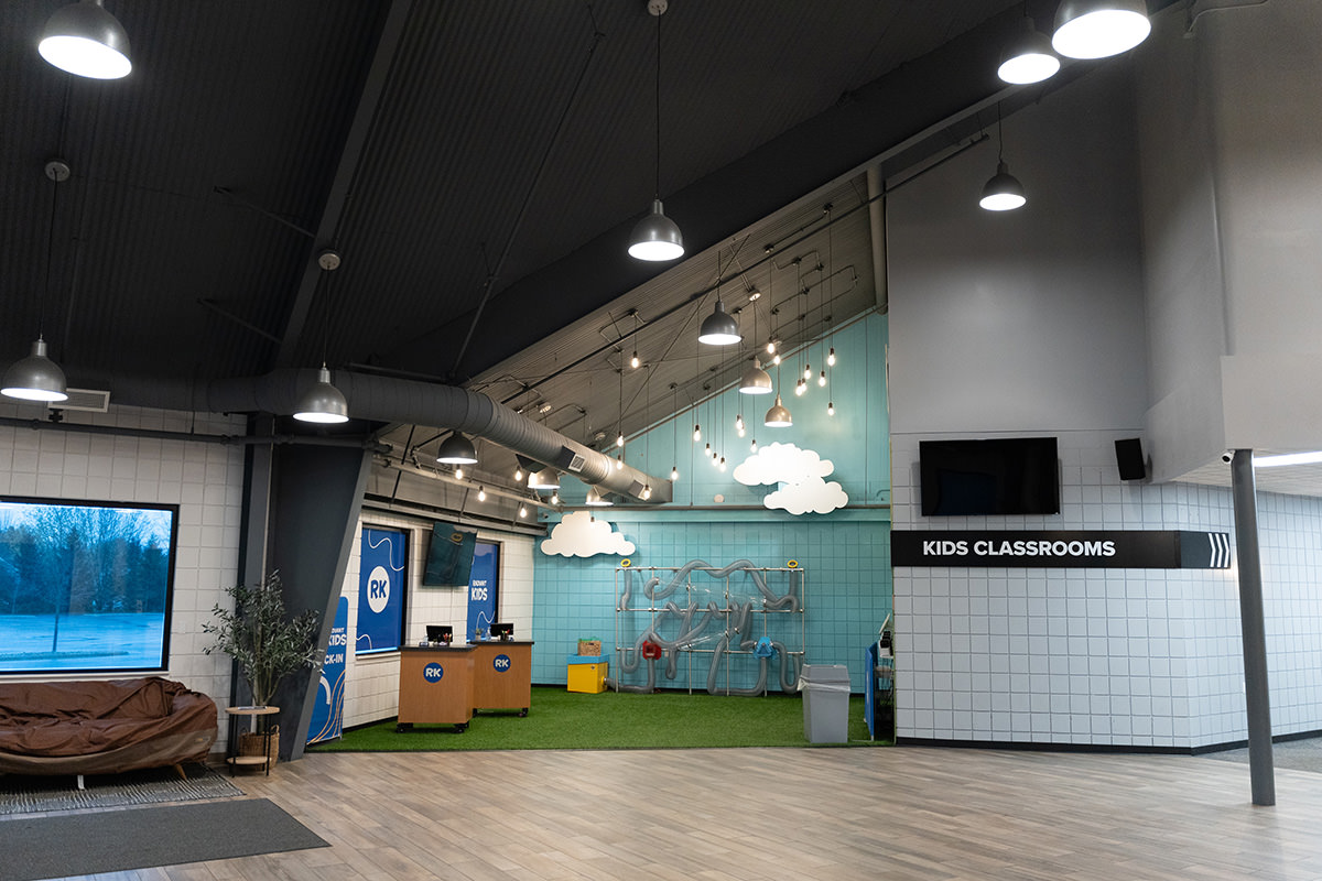 PMV - Project Highlight - Radiant Church Kids Area Lobby Church lobby with blue kids check in section.