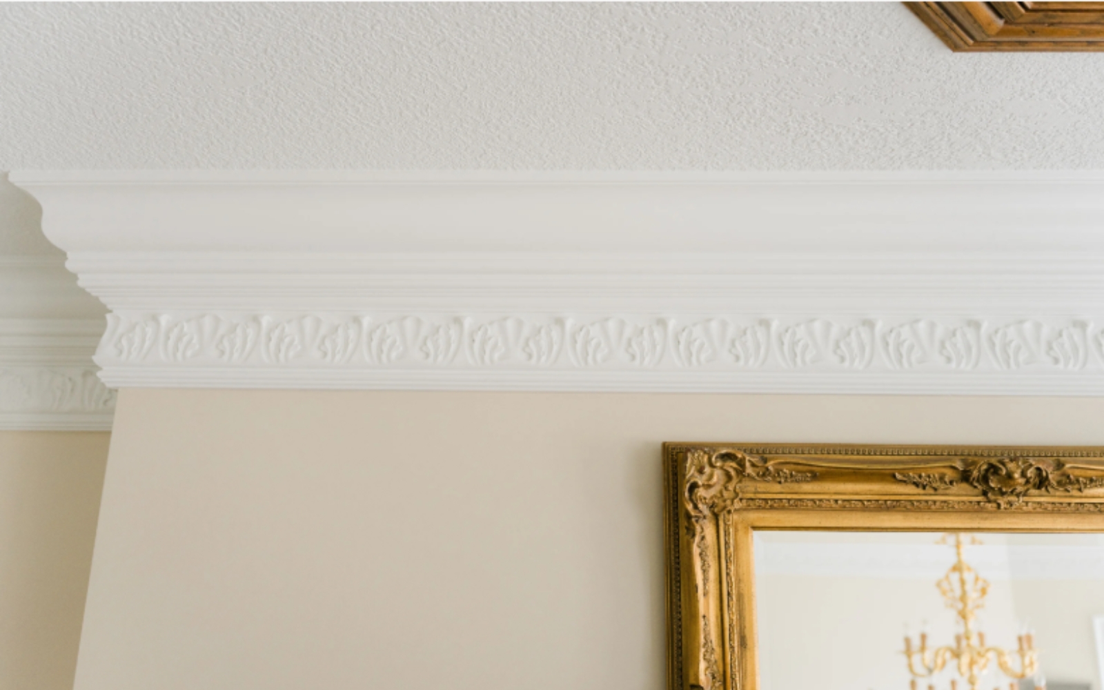Fine trim and millwork featuring detailed crown molding painted by PMV Painting