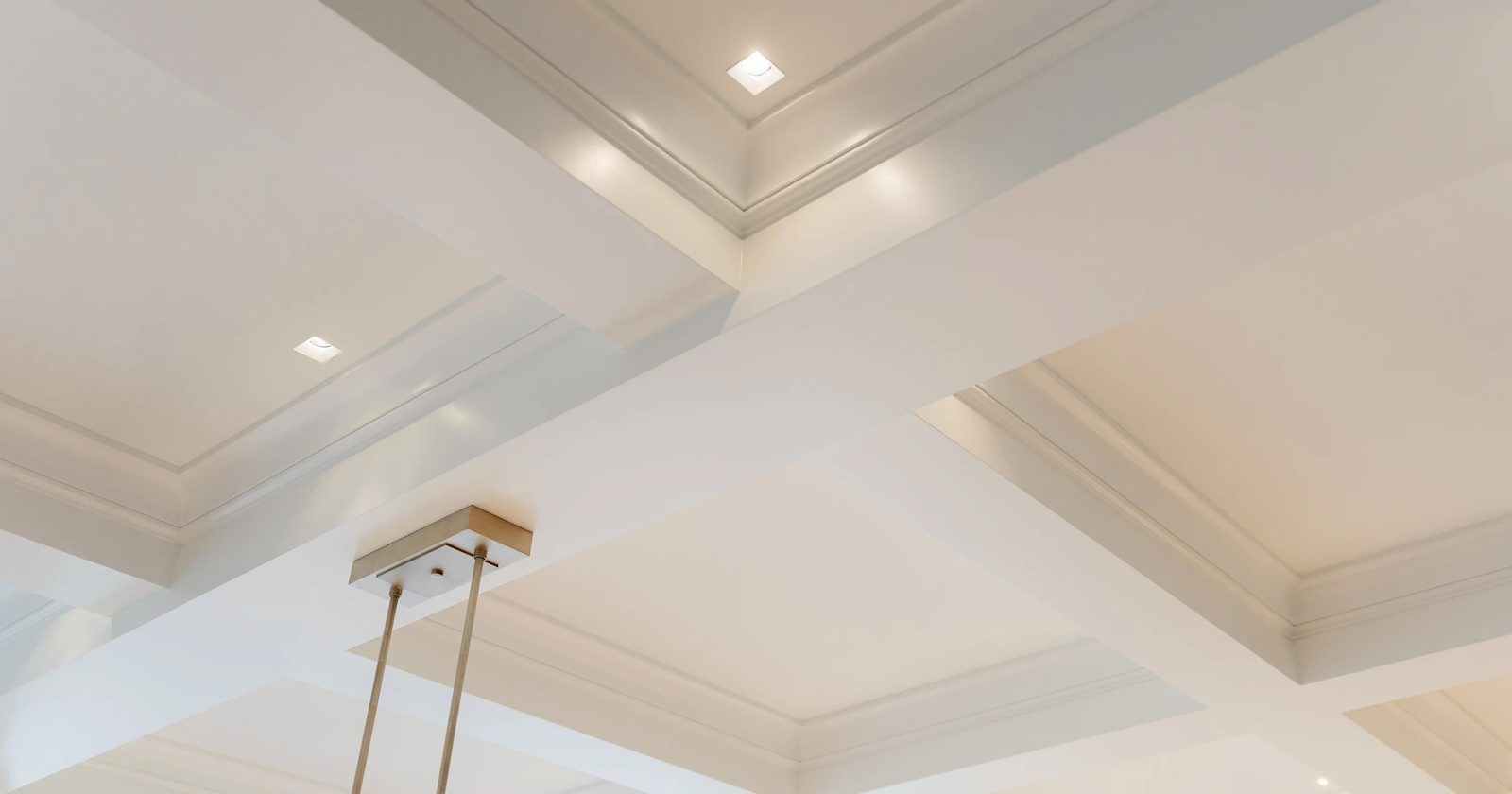 High-end interior painting with detailed ceiling trim and architectural finishes by PMV Painting