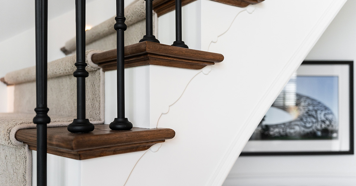 Precision interior painting detail on staircase trim and wall by PMV Painting