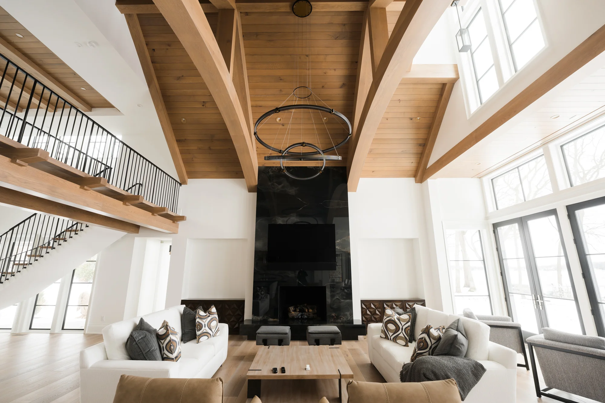 Paint preparation for high-end homes shown through smooth interior living room walls and detailed ceiling beams in Kalamazoo home