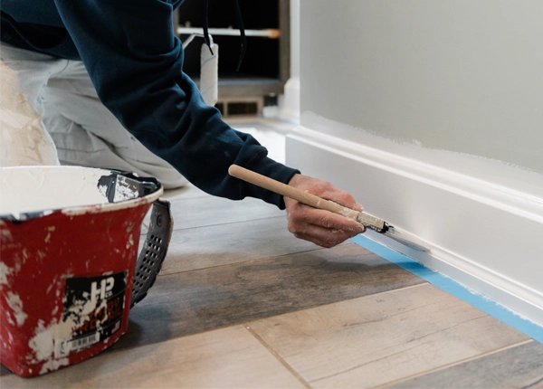 PMV Painting craftsman carefully painting interior trim detail inside a Richland, Michigan home