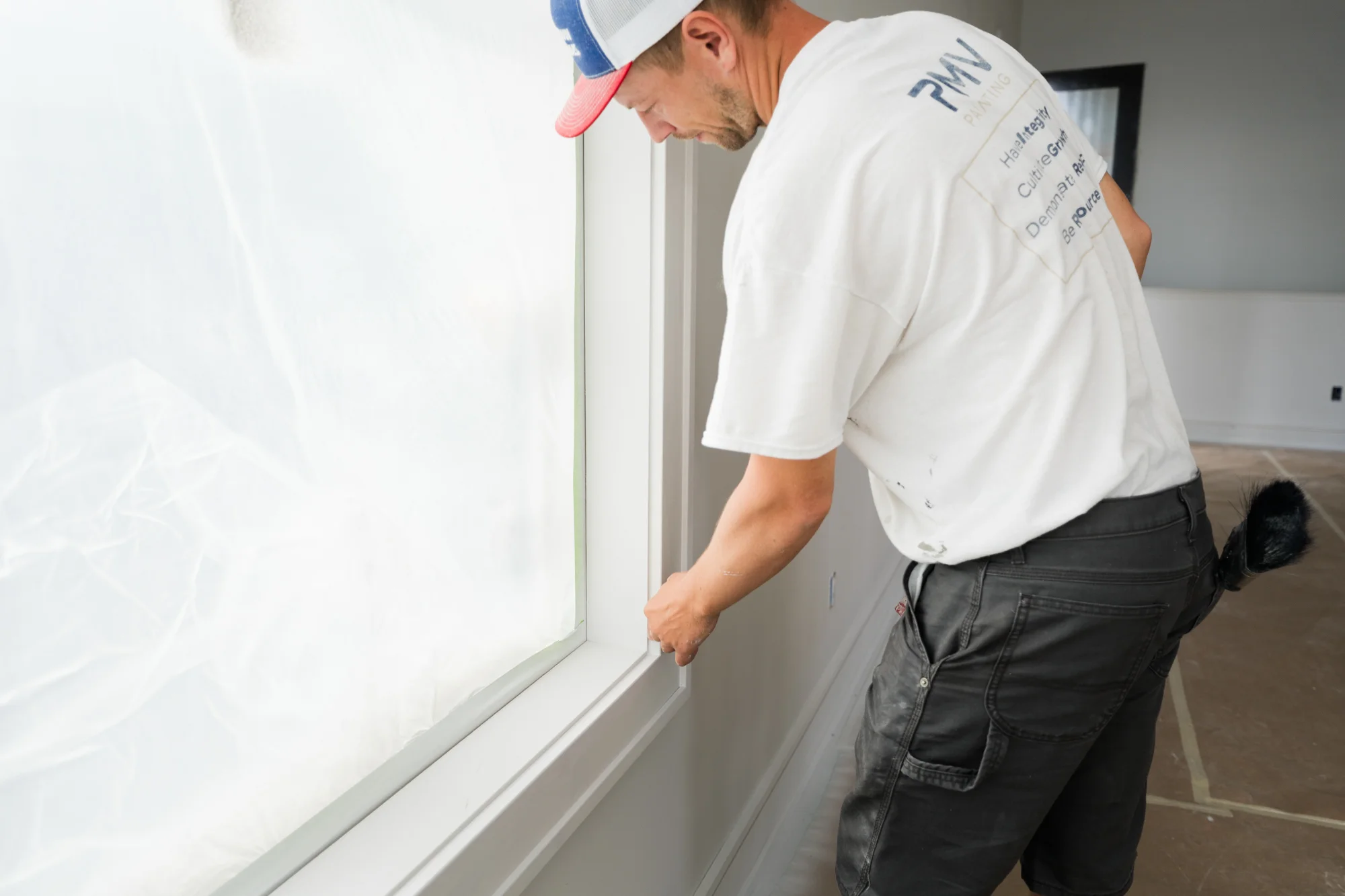PMV Painting team member preparing and protecting surfaces before a commercial painting project to minimize disruption.