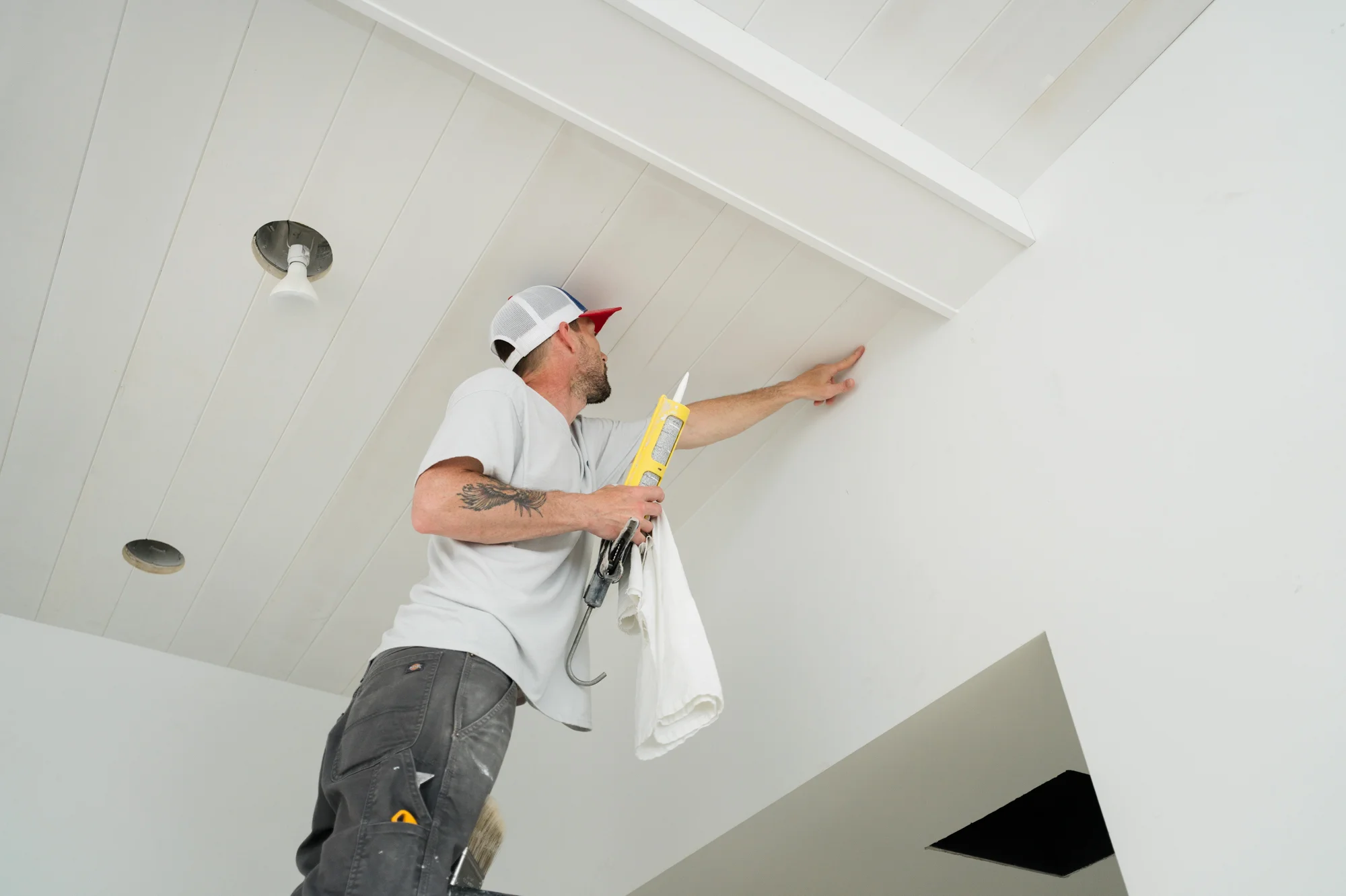 PMV painter completing detailed finish work on an interior